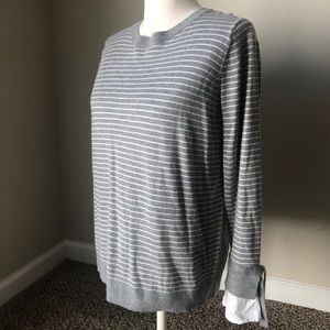 Stripped sweater with blouse like wrist detail